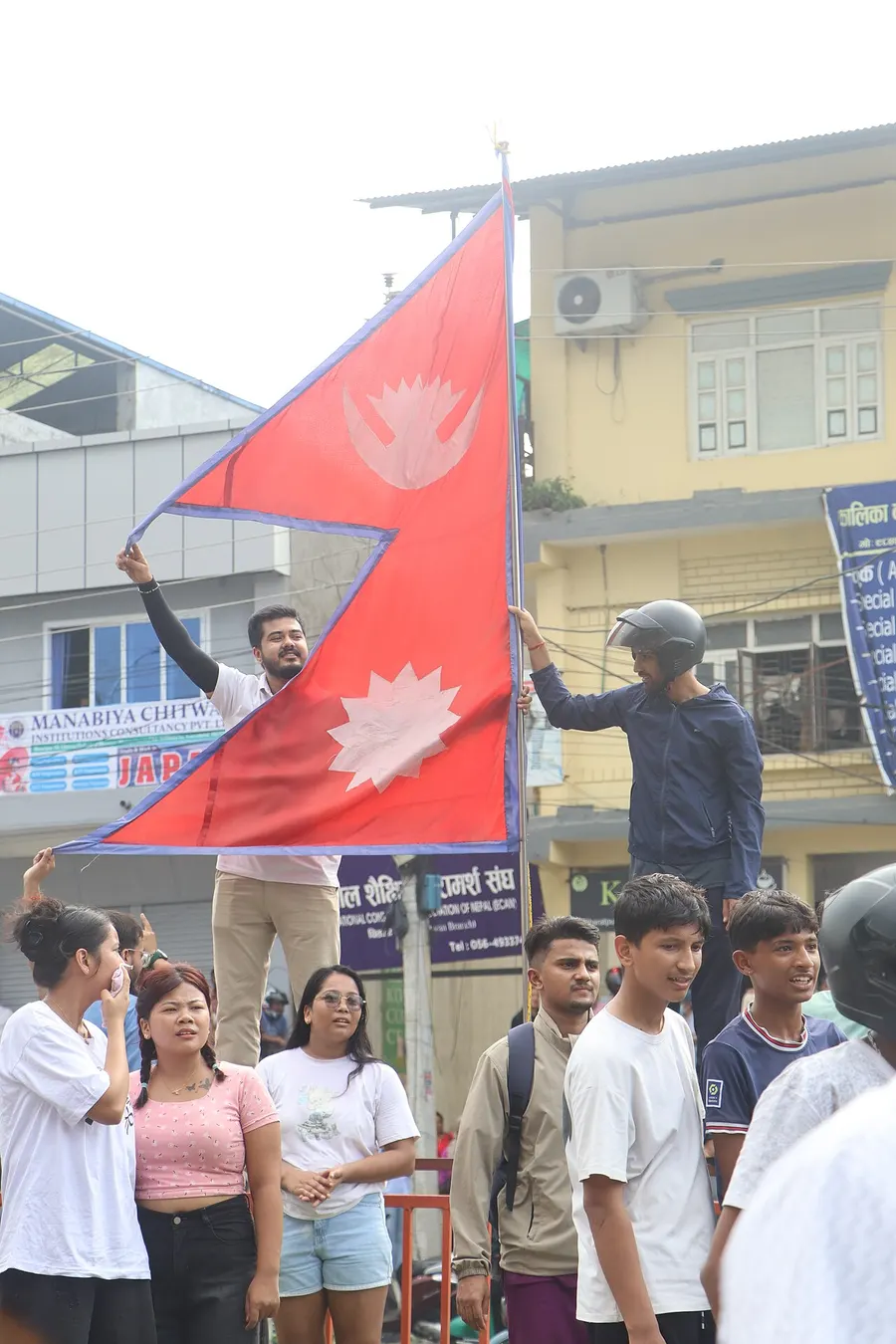 Young protesters in Nepal waving the national flag during the Gen Z movement